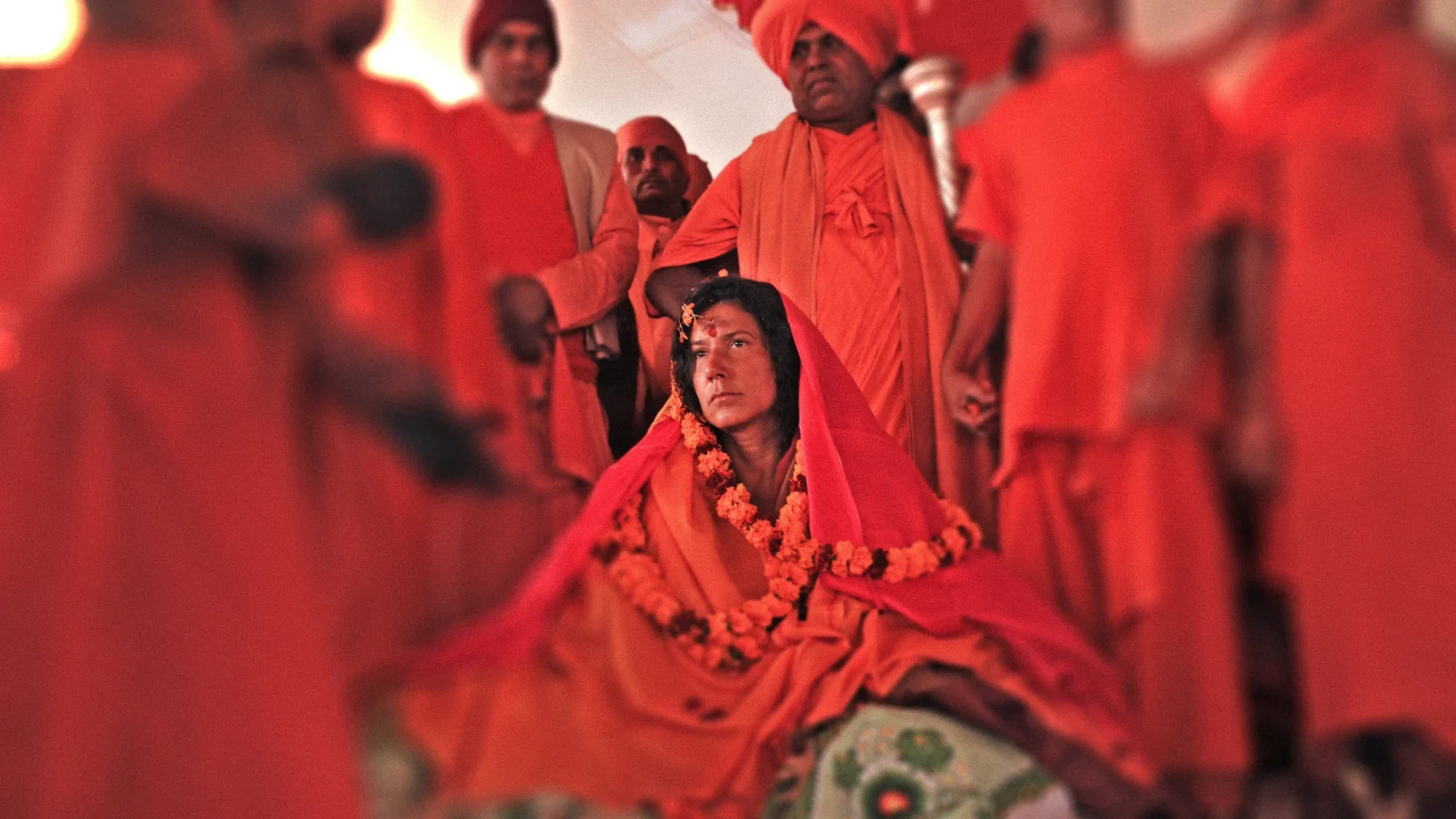 Mataji Shaktiananda with a veil and an orange garland among masters of the Vedic tradition